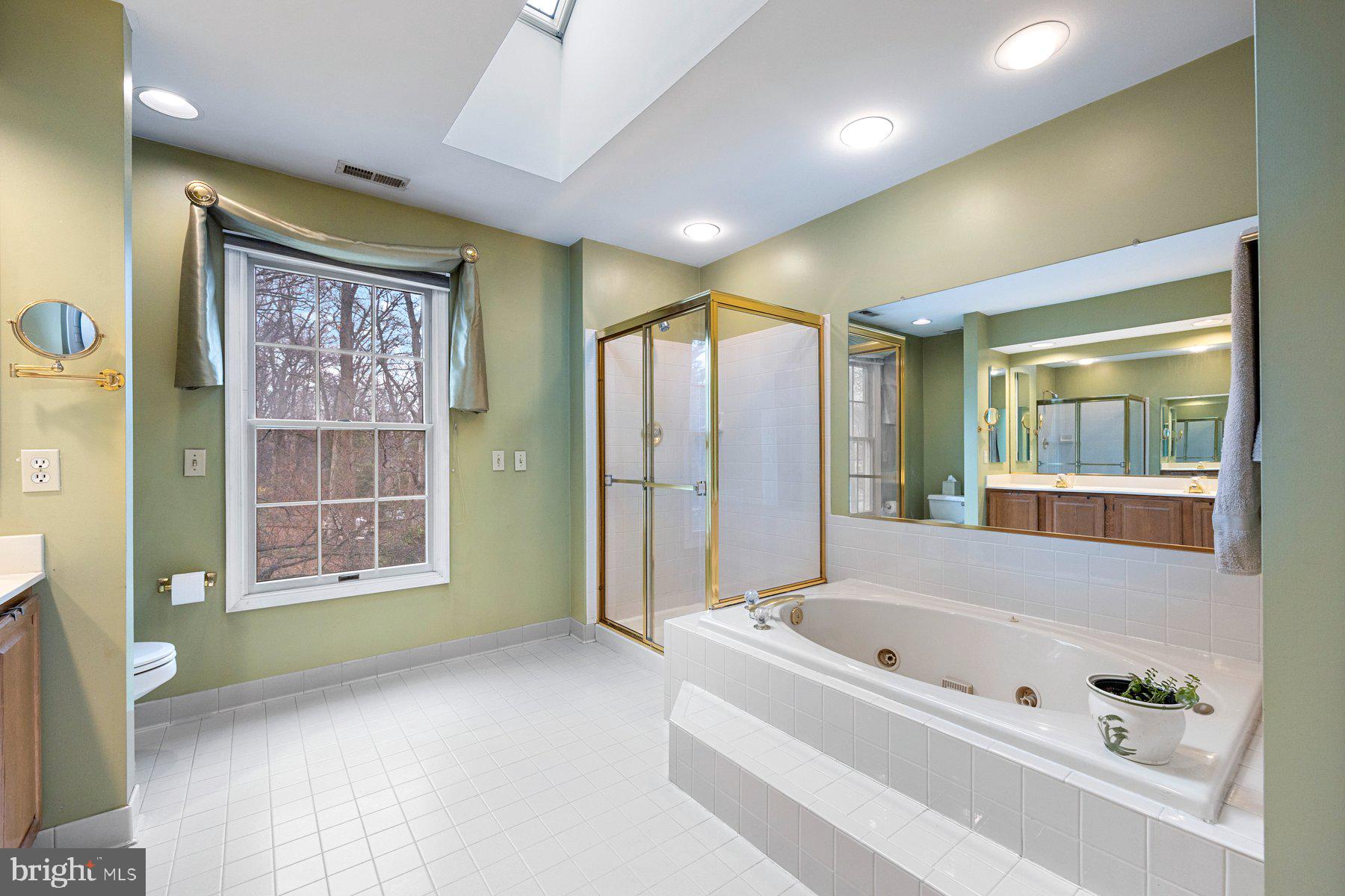 8037 Crest Road Laurel, MD 20723 - Photo 22 of 60 a bathroom with a bathtub and a shower