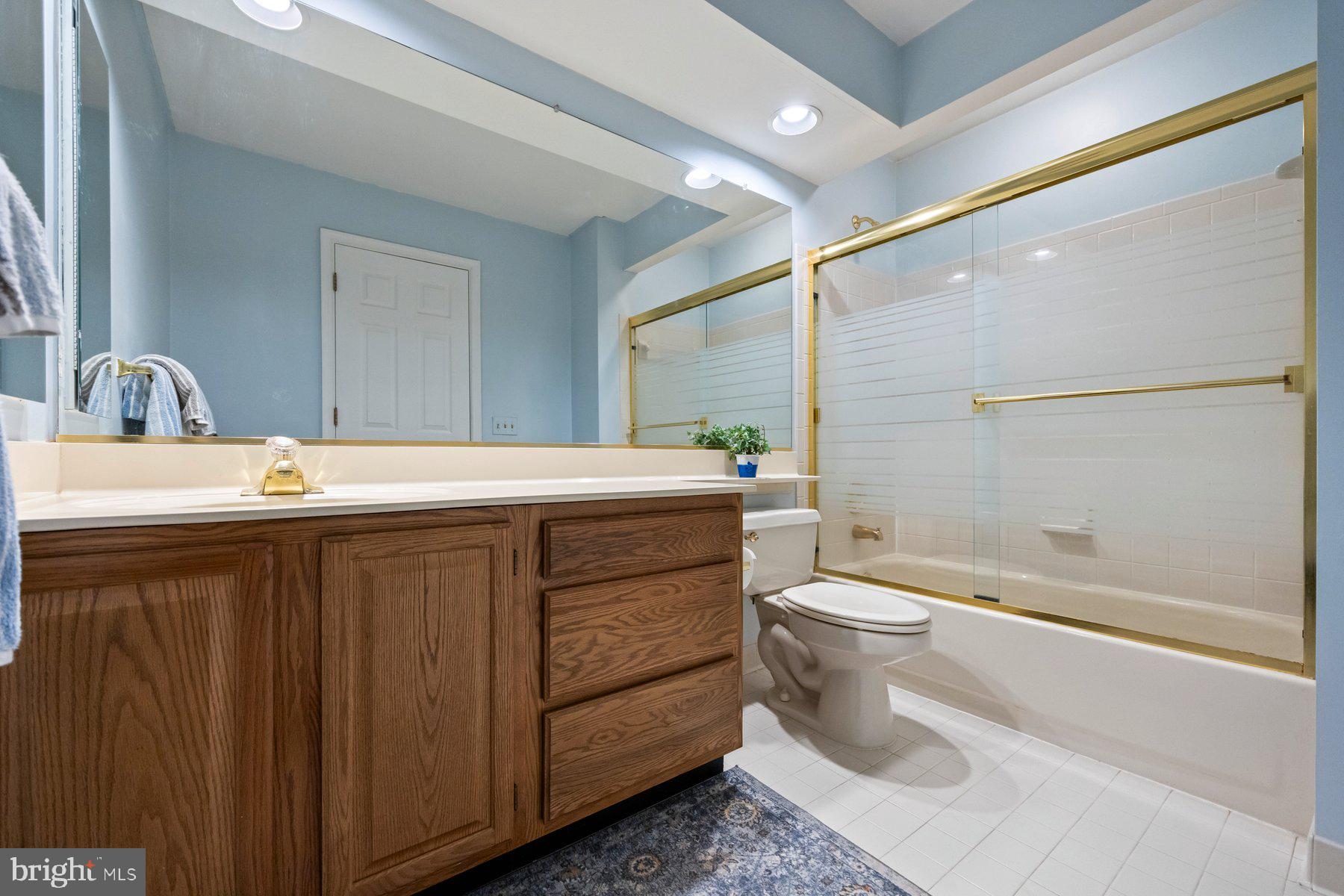 8037 Crest Road Laurel, MD 20723 - Photo 26 of 60 a bathroom with a sink a toilet and shower