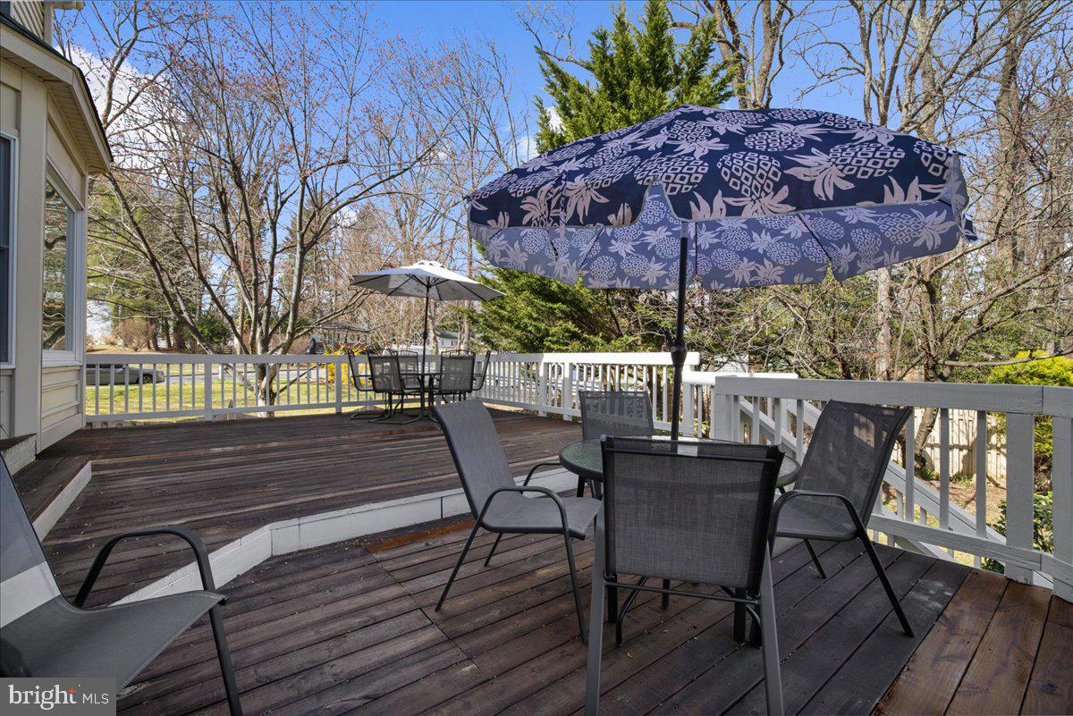 8037 Crest Road Laurel, MD 20723 - Photo 33 of 60 a view of patio with table and chairs and potted plants