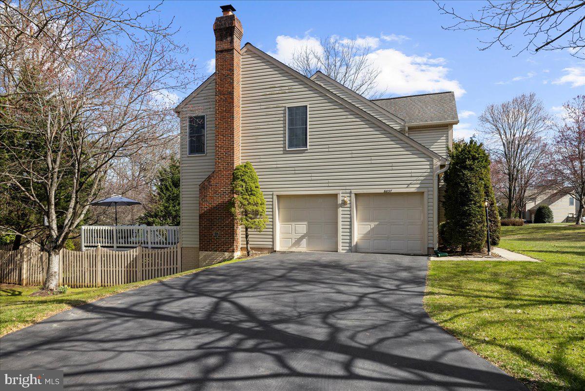 8037 Crest Road Laurel, MD 20723 - Photo 37 of 60 a front view of a house with a yard