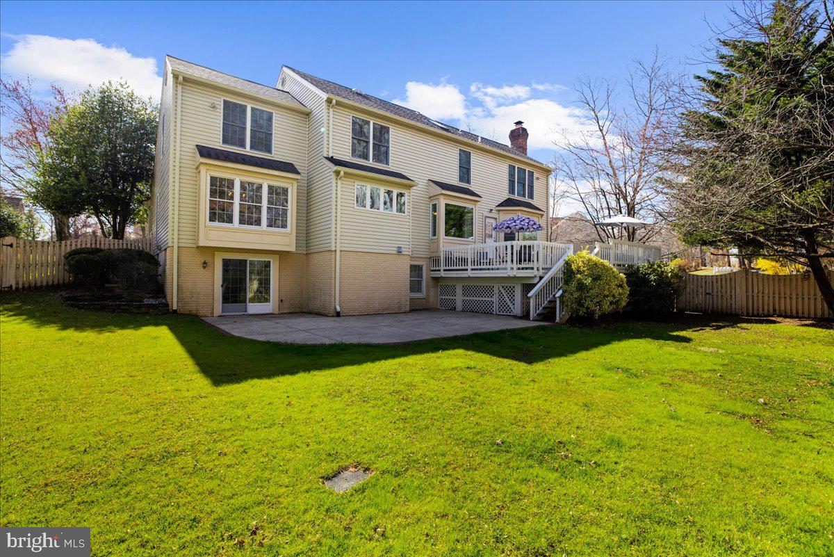 8037 Crest Road Laurel, MD 20723 - Photo 40 of 60 a front view of a house with a yard table and chairs