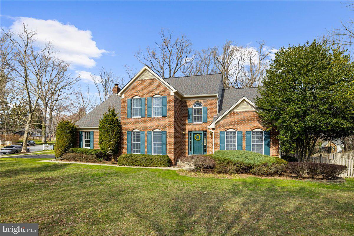 8037 Crest Road Laurel, MD 20723 - Photo 43 of 60 a front view of a house with a garden