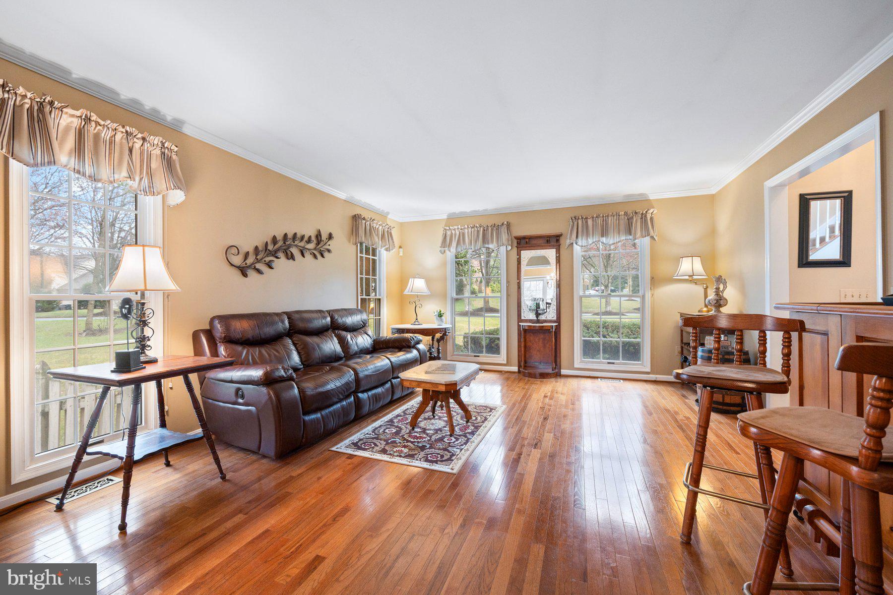 8037 Crest Road Laurel, MD 20723 - Photo 5 of 60 a living room with furniture and a wooden floor