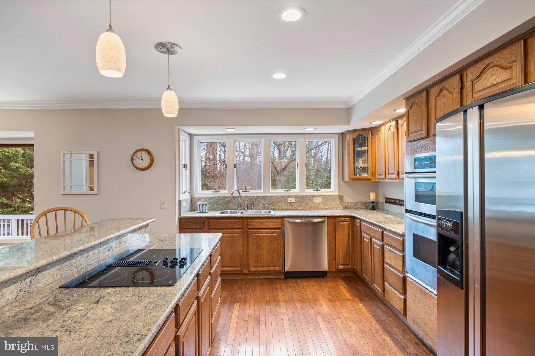 8037 Crest Road Laurel, MD 20723 - Photo 10 of 60 a large kitchen with a large window and stainless steel appliances