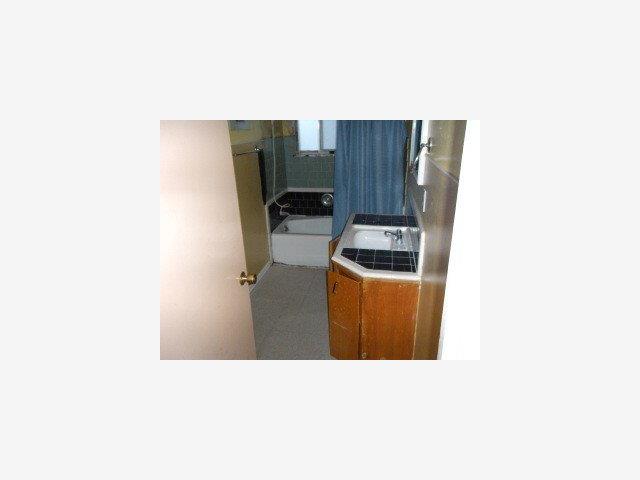 105 Progress Avenue Watsonville, CA 95076 - Photo 4 of 5 a kitchen with a sink and cabinets