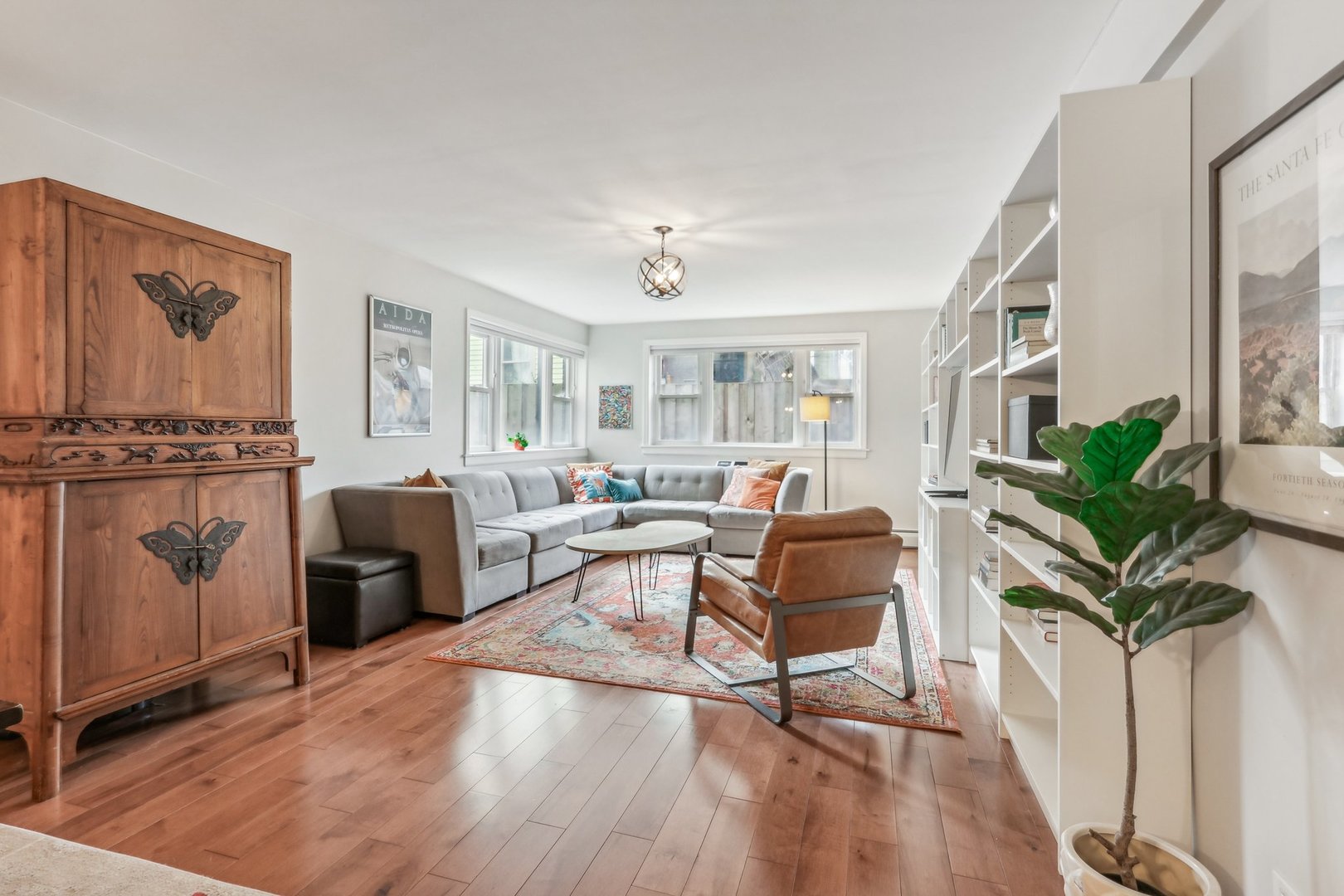 815 Reba Place, Unit 104 Evanston, IL 60202 - Photo 3 of 26 a living room with furniture a large window and wooden floor