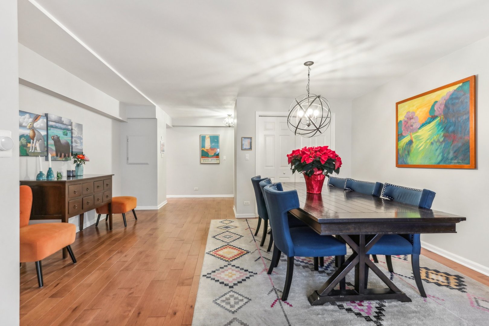 815 Reba Place, Unit 104 Evanston, IL 60202 - Photo 7 of 26 a view of a dining room with furniture wooden floor and a chandelier