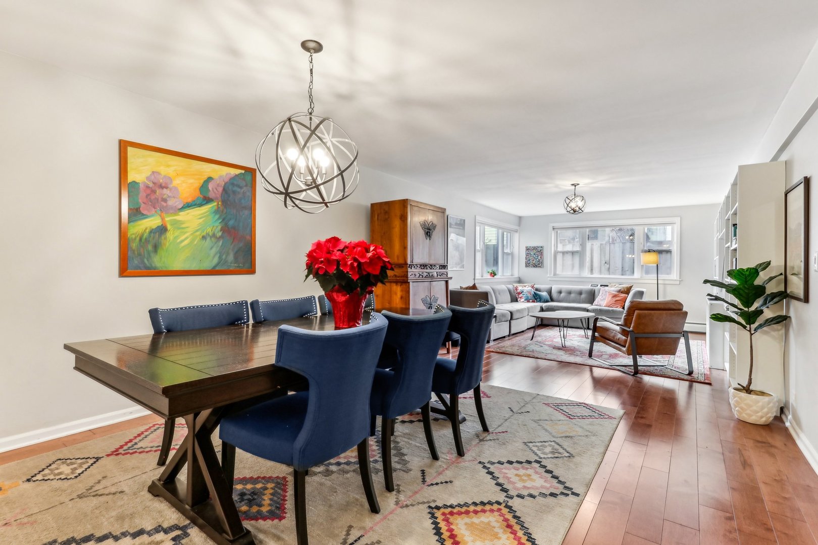 815 Reba Place, Unit 104 Evanston, IL 60202 - Photo 9 of 26 a dining room with furniture a chandelier and wooden floor
