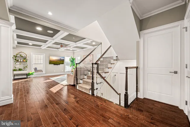 a view of entryway with wooden floor