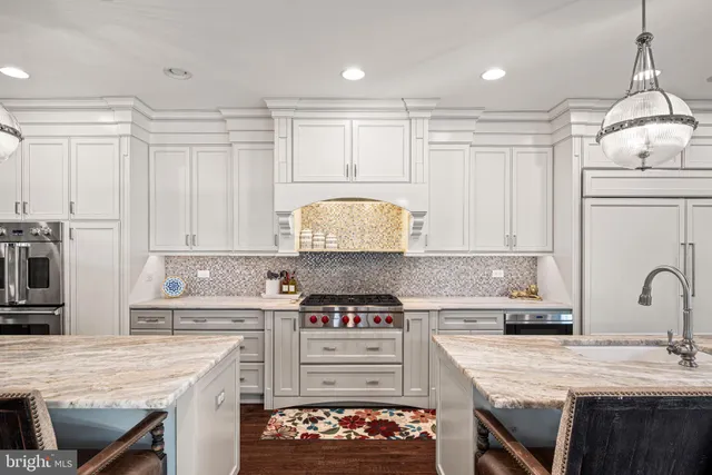 a kitchen with a stove a sink and a refrigerator