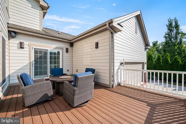 a view of a house with wooden deck
