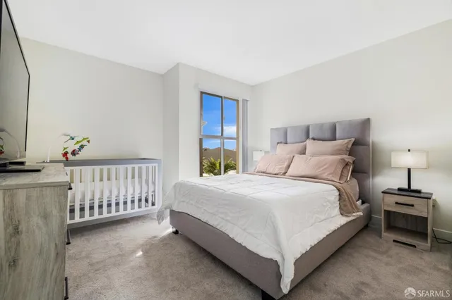 a bed room with a bed and a window
