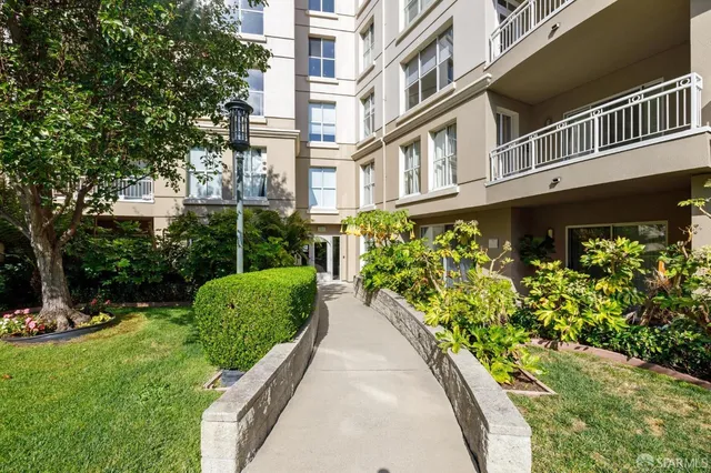 a swimming pool with outdoor seating and yard