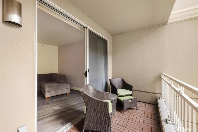 a living room with furniture and a rug