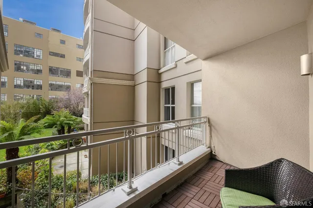 a view of balcony with furniture