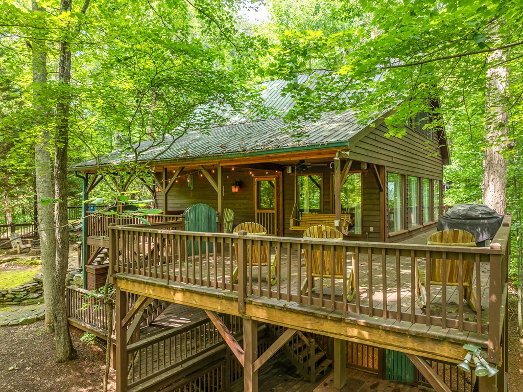 197 Smith Hill Road Blue Ridge, GA 30513 - Photo 13 of 36 a view of a chair and table on the deck