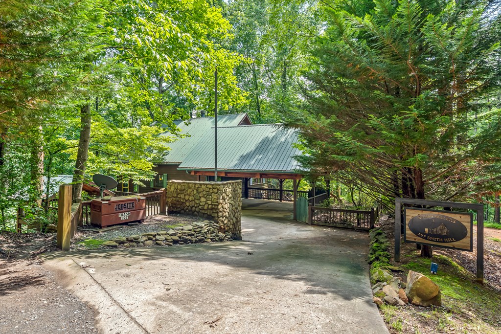197 Smith Hill Road Blue Ridge, GA 30513 - Photo 2 of 36 a backyard of a house with barbeque oven table and chairs
