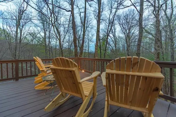 197 Smith Hill Road Blue Ridge, GA 30513 - Photo 31 of 36 a view of a roof deck with table and chairs with wooden floor and fence