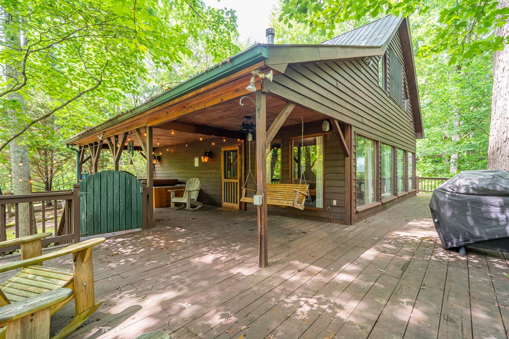 197 Smith Hill Road Blue Ridge, GA 30513 - Photo 6 of 36 a view of a house with a patio