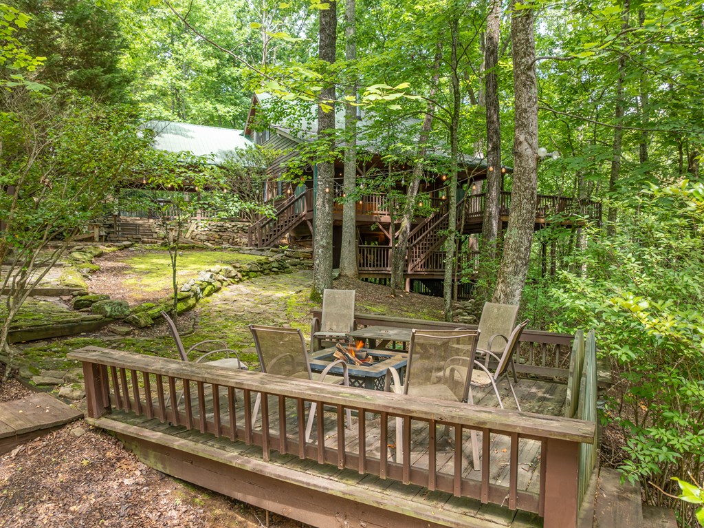 197 Smith Hill Road Blue Ridge, GA 30513 - Photo 8 of 36 a view of a chair and tables in the balcony