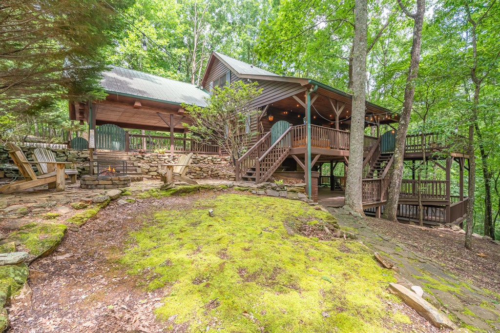197 Smith Hill Road Blue Ridge, GA 30513 - Photo 9 of 36 a view of a house with backyard and sitting area