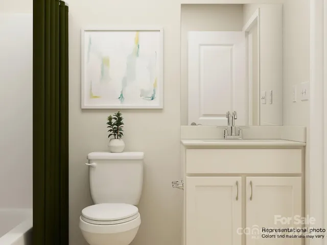 a bathroom with a toilet a sink and a mirror