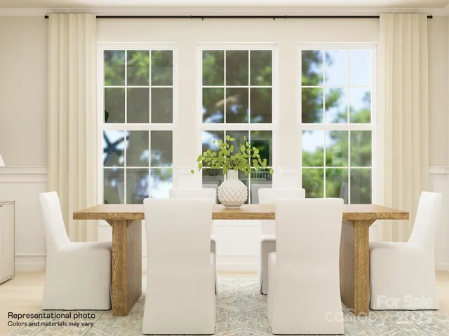 a living room with furniture and windows