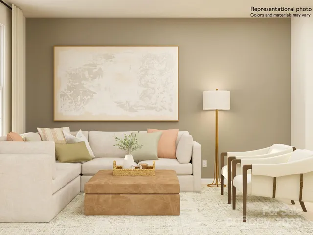 a living room with furniture and a lamp