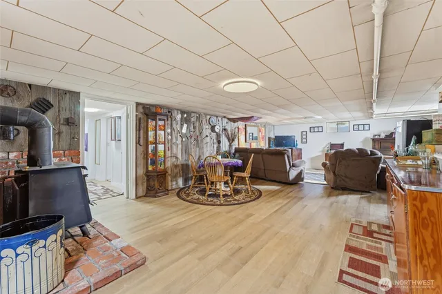a living room with furniture a window and gym equipment