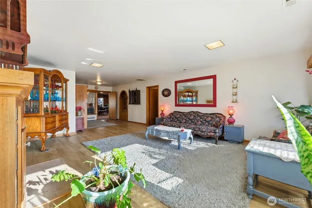 a living room with furniture and a rug
