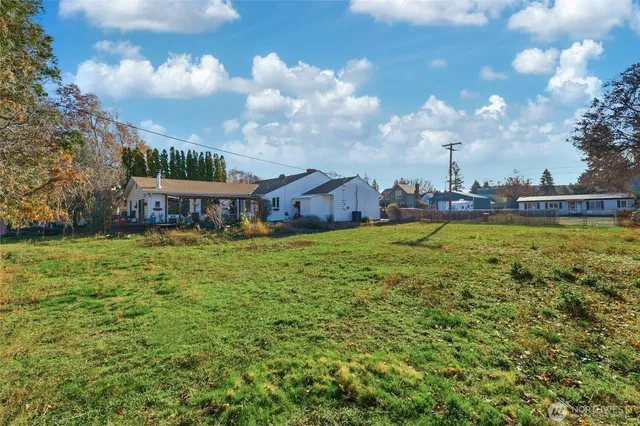 an aerial view of a house with swimming pool garden and lake view