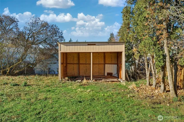 a view of yard with patio