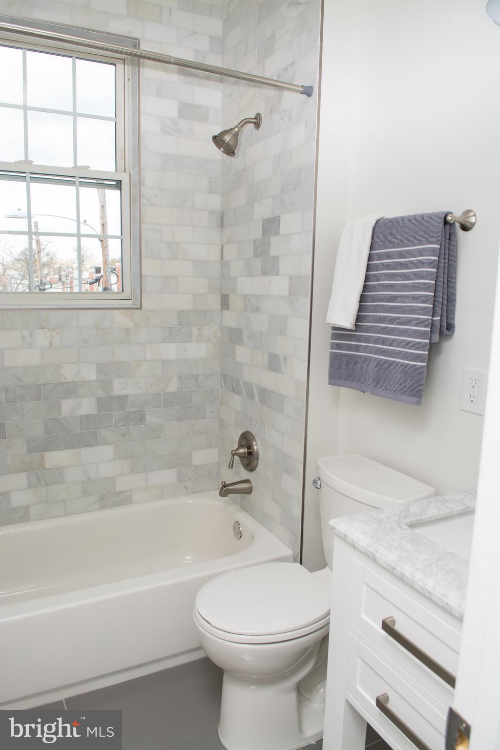 6216 5th Street Northwest Washington, DC 20011 - Photo 11 of 25 a bathroom with a toilet and a shower