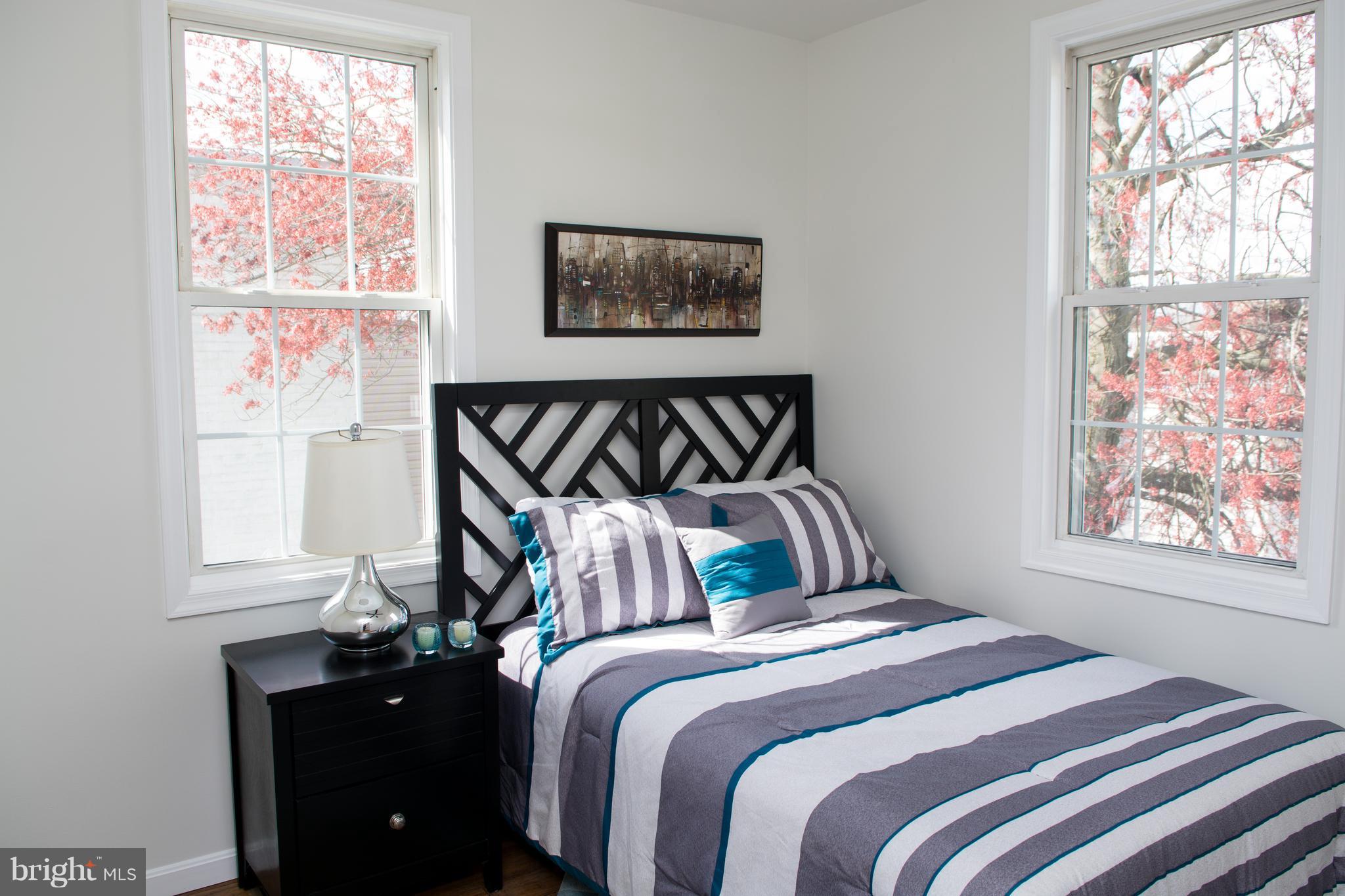 6216 5th Street Northwest Washington, DC 20011 - Photo 12 of 25 a bedroom with a bed and a window