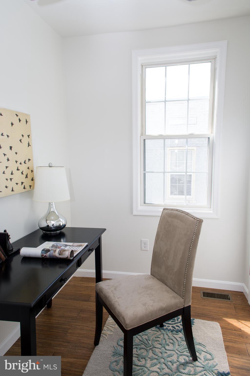 6216 5th Street Northwest Washington, DC 20011 - Photo 13 of 25 a living room with furniture and next to a window