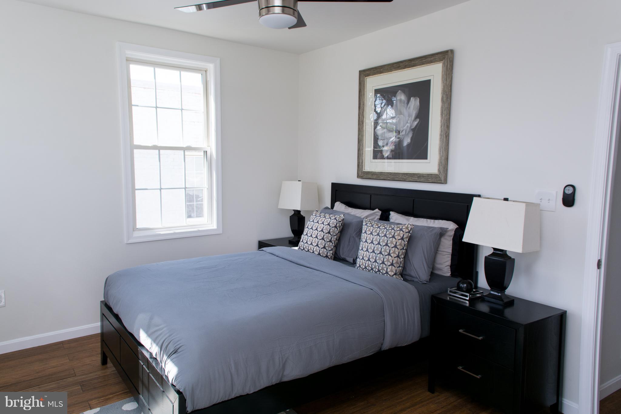 6216 5th Street Northwest Washington, DC 20011 - Photo 14 of 25 a bedroom with a bed and a window