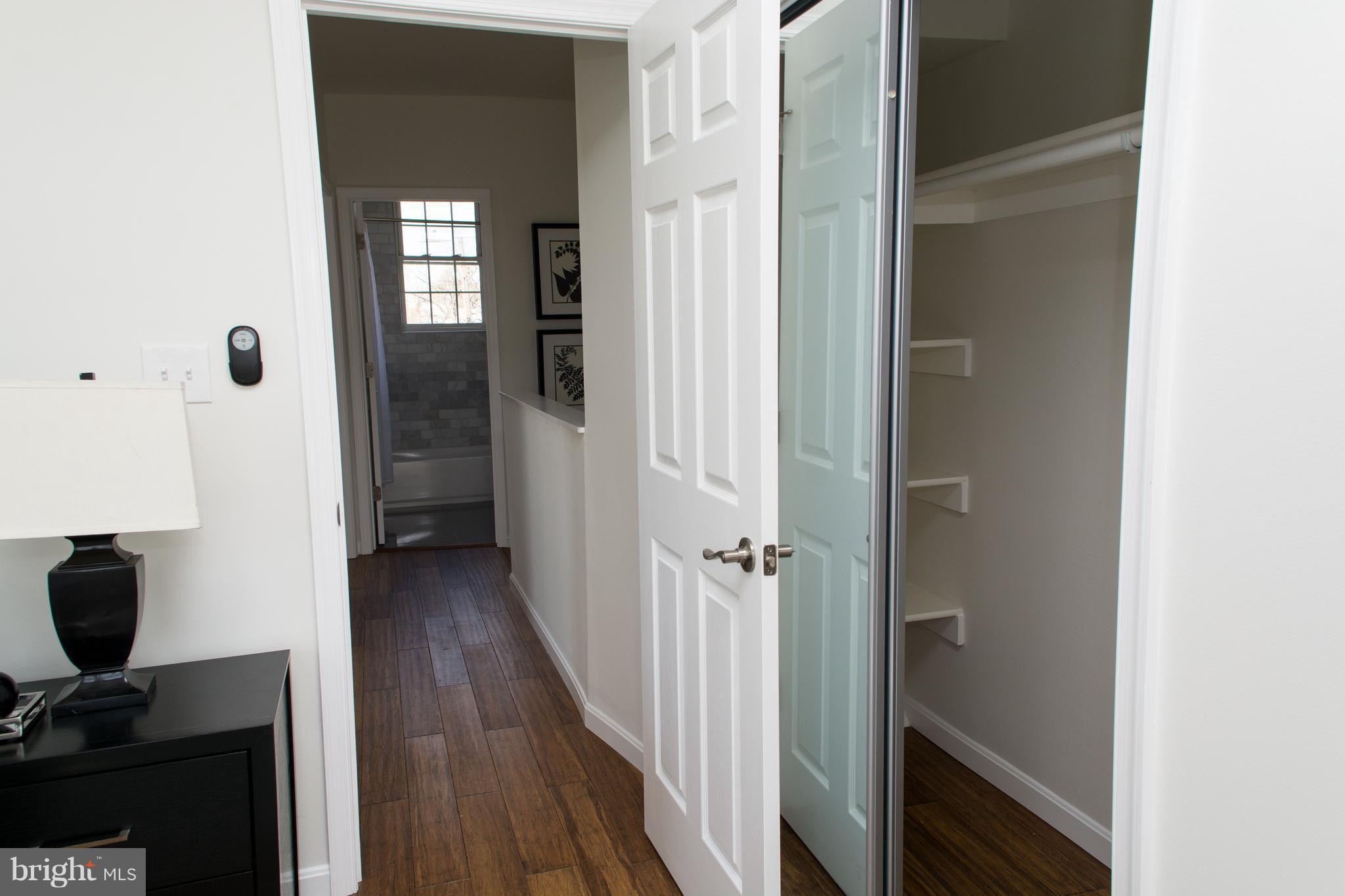 6216 5th Street Northwest Washington, DC 20011 - Photo 16 of 25 a view of a hallway with wooden floor and closet