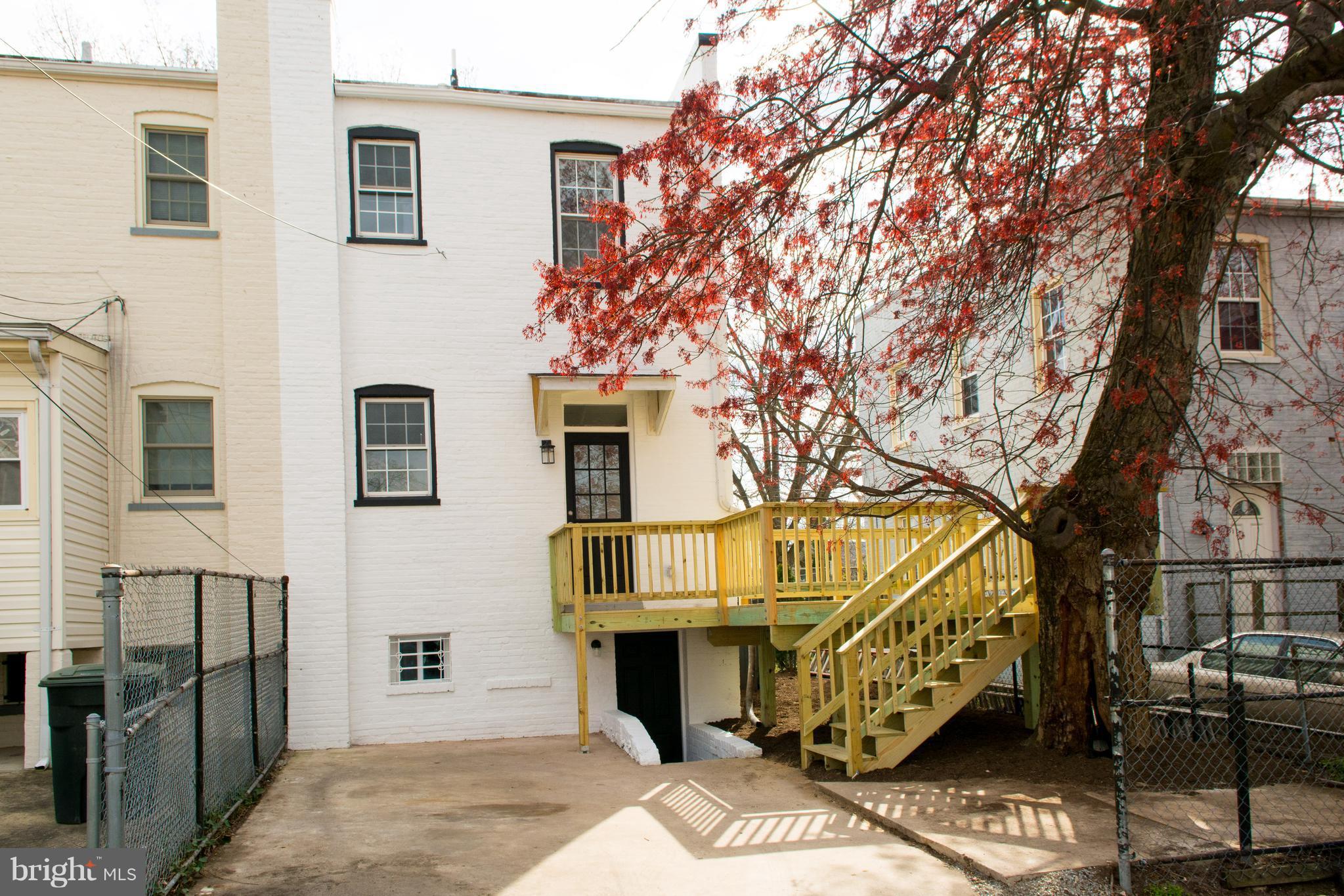 6216 5th Street Northwest Washington, DC 20011 - Photo 22 of 25 a front view of a house with parking