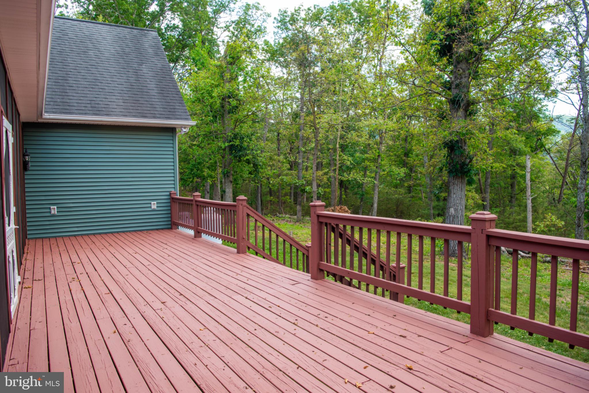 792 Forest Glen Road Moorefield, WV 26836 - Photo 126 of 146 Spacious deck surrounded by nature.