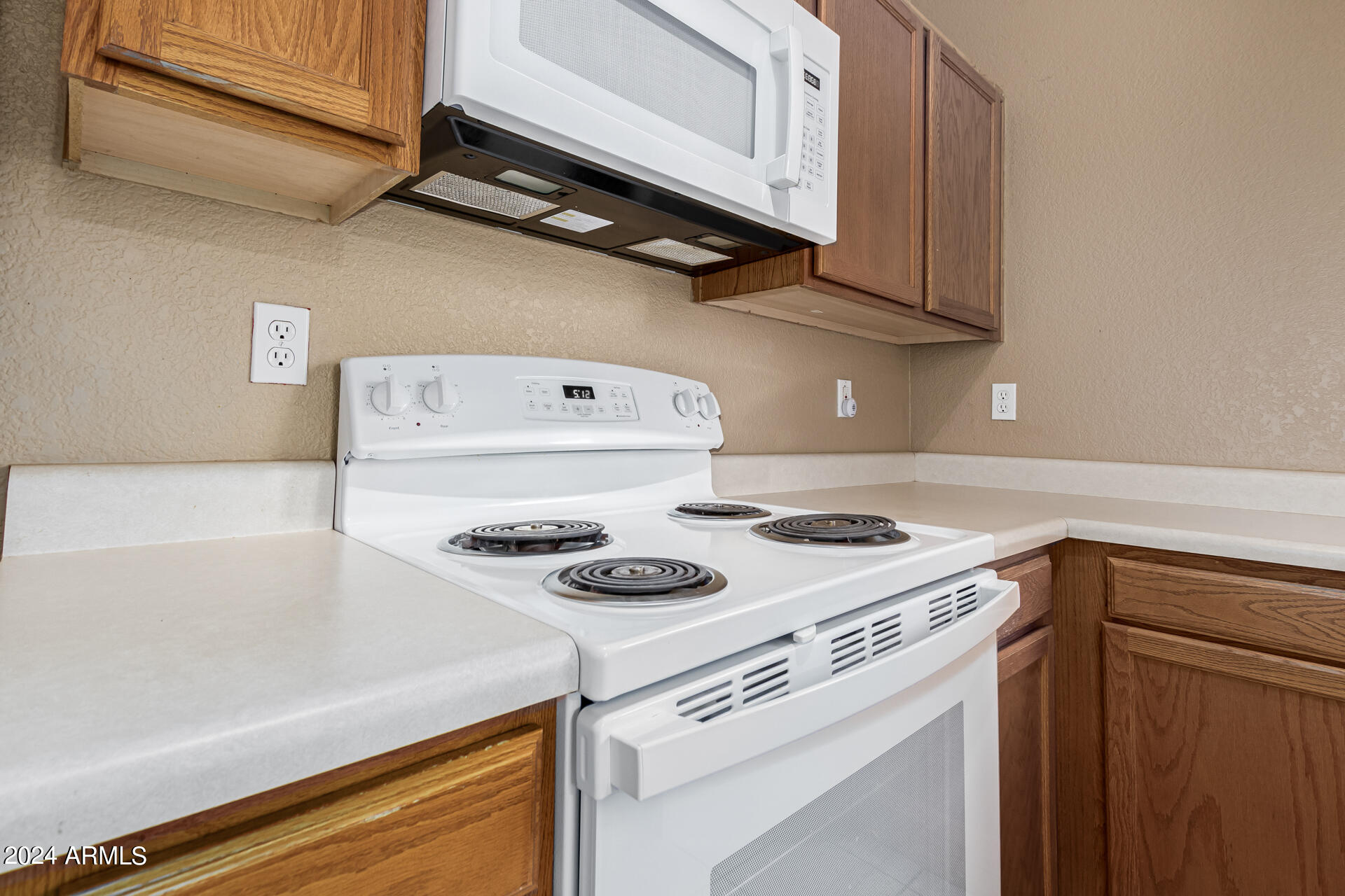 1371 South Boulder Street, Unit A Gilbert, AZ 85296 - Photo 18 of 43 a white stove top oven sitting inside of a kitchen