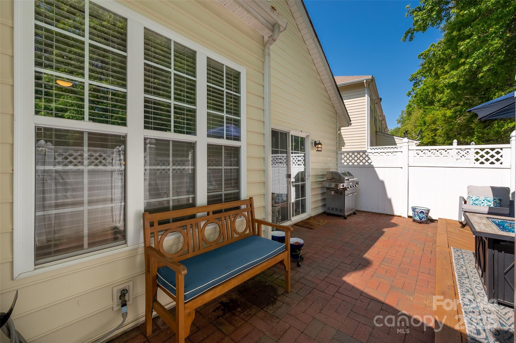969 Copperstone Lane Fort Mill, SC 29708 - Photo 30 of 36 a blue bench sitting in front of a building