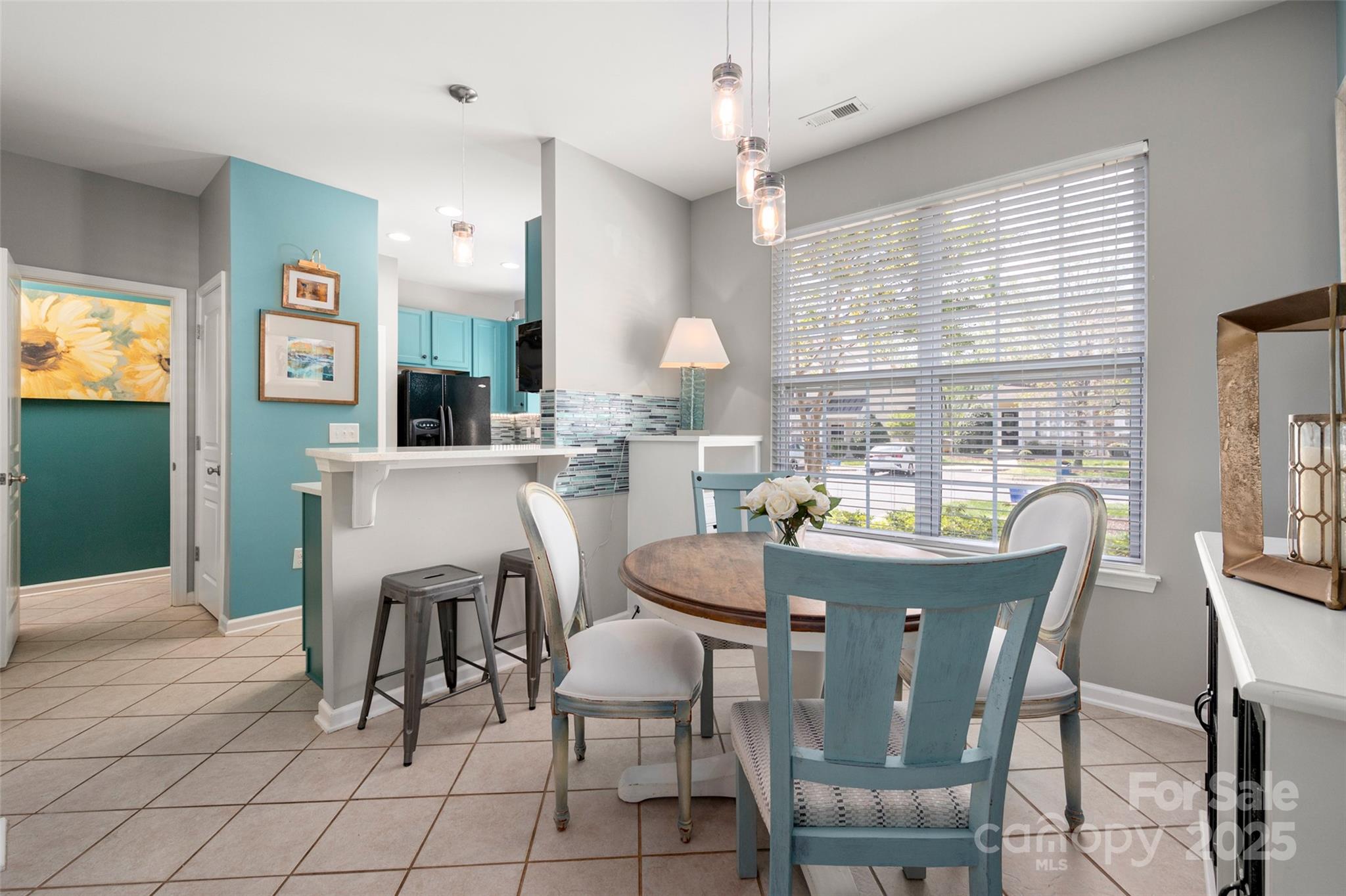 969 Copperstone Lane Fort Mill, SC 29708 - Photo 3 of 36 a dining room with furniture a window and kitchen view