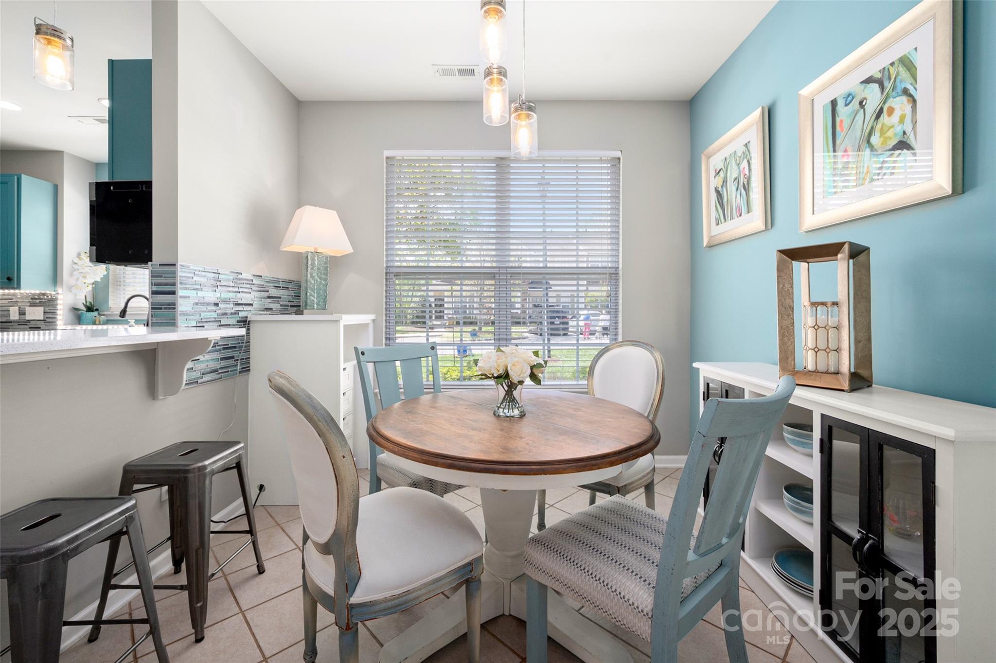 969 Copperstone Lane Fort Mill, SC 29708 - Photo 4 of 36 a dining room with furniture a chandelier and window