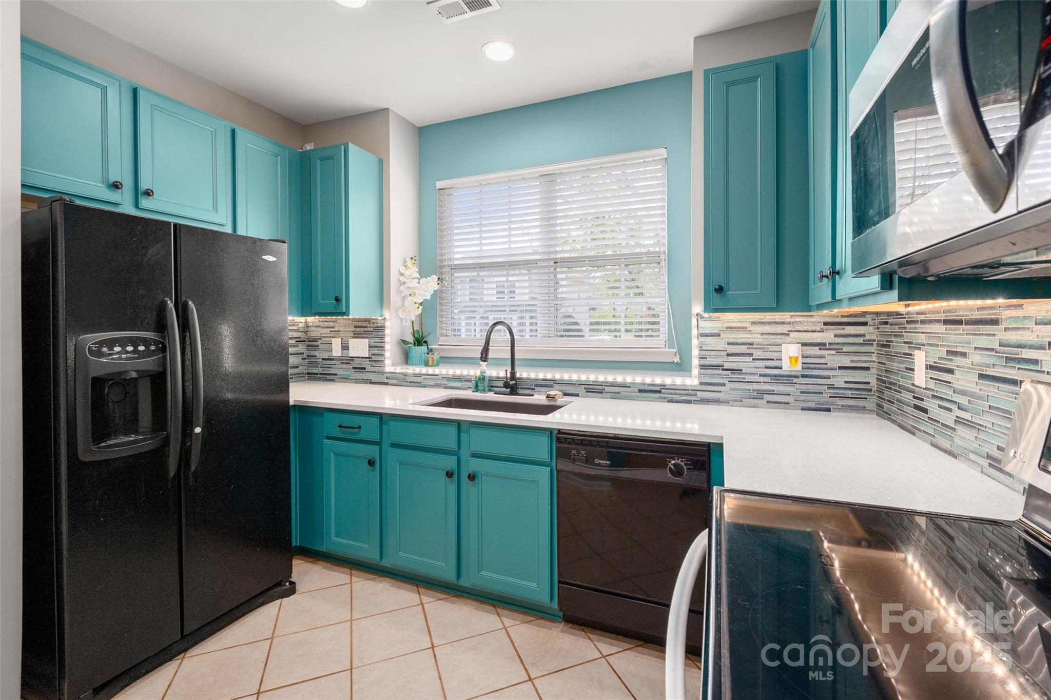 969 Copperstone Lane Fort Mill, SC 29708 - Photo 6 of 36 a kitchen with stainless steel appliances granite countertop a refrigerator and a sink