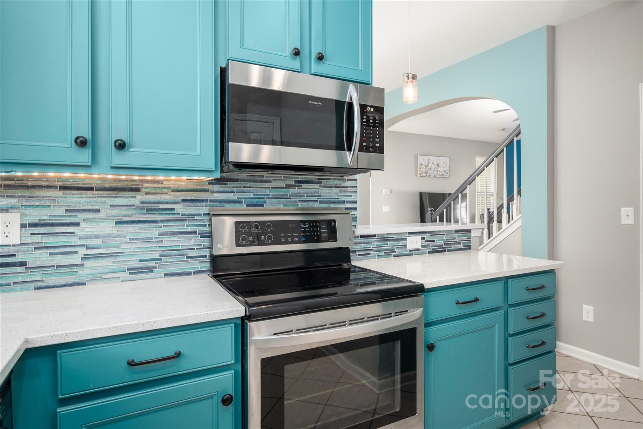 969 Copperstone Lane Fort Mill, SC 29708 - Photo 9 of 36 a kitchen with a stove and a microwave