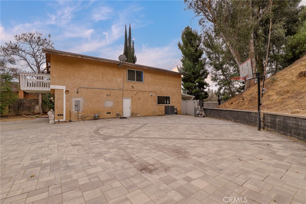 20643 Calhaven Drive Saugus, CA 91390 - Photo 3 of 6 a view of a house with a yard and garage