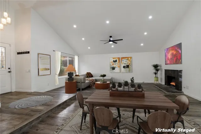 a living room with fireplace furniture and a fireplace