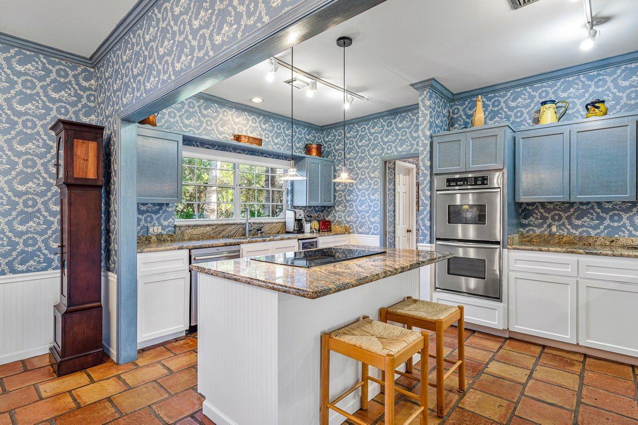 169 Apollo Circle Jupiter, FL 33477 - Photo 11 of 54 a kitchen with stainless steel appliances granite countertop a refrigerator and a stove