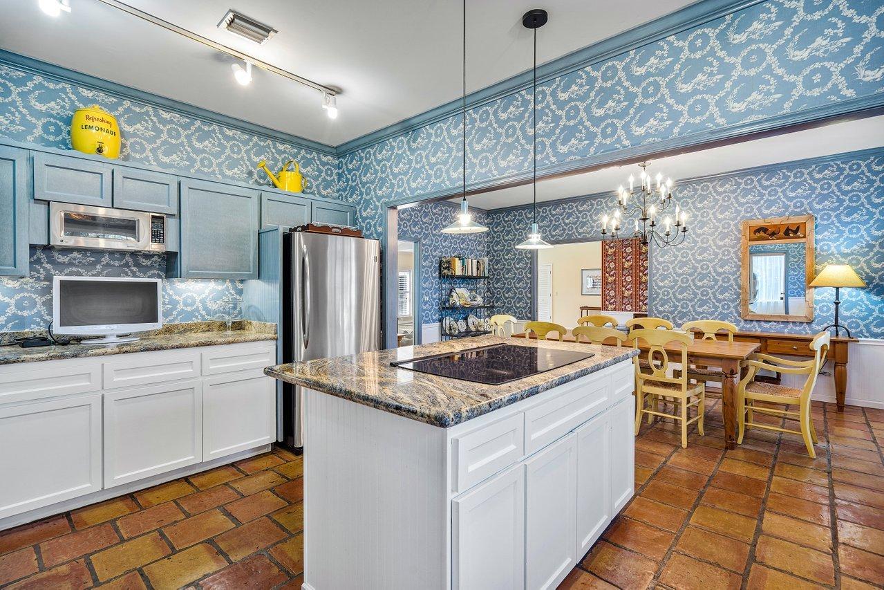 169 Apollo Circle Jupiter, FL 33477 - Photo 12 of 54 a kitchen with stainless steel appliances granite countertop a sink and cabinets
