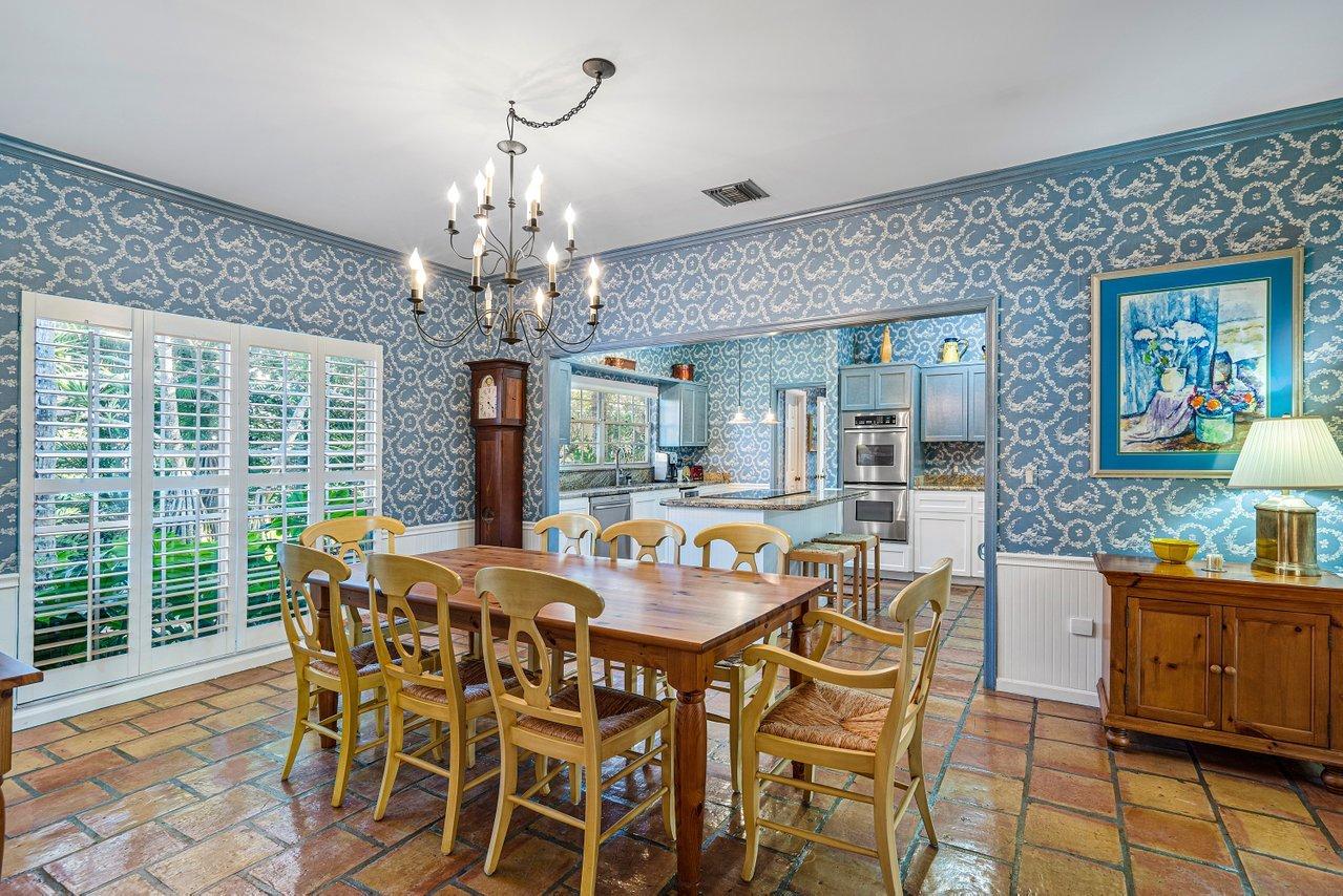 169 Apollo Circle Jupiter, FL 33477 - Photo 13 of 54 a view of a dining room with furniture wooden floor and chandelier